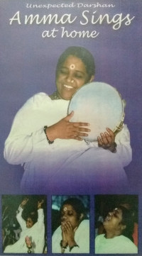 Amma playing tambourine