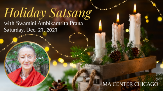 3 lit candles amid holiday greenery alongside a photo of Swamini Ambikamrita Prana