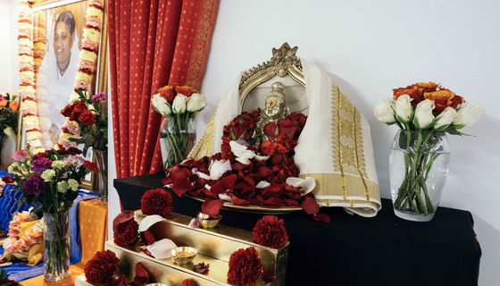 Statue of Lord Ayyappa at the top of golden steps