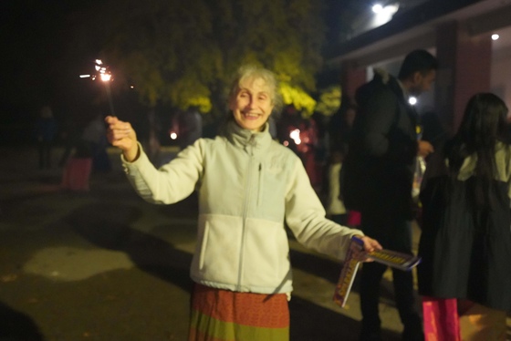 A Diwali celebrant waving a sparkler