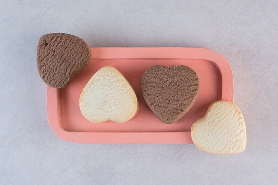 Heart-shaped cookies on pink plate