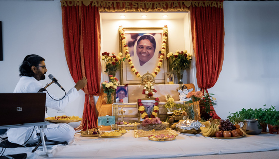 Ramanand in front of Vishu altar with seedlings