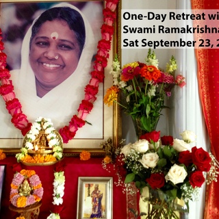 Altar with Amma's photo, beautifully decorated with flowers