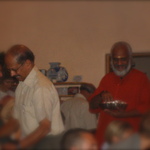 Chandran and Swami passing out prasad