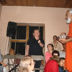 Swami passing out prasad
