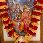 Picture of Shiva, Parvati and Ganesha with flower garland