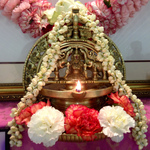 Lamps with jasmine garland and carnation blossoms