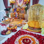 Beautifully decorated altar with flowers and fresh fruits