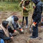 AYUDH volunteers planting trees together