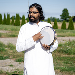 Br. Ramanand playing tambourine