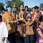 Mother and sons carrying Sri Krishna in procession