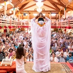 Amma arrived on stage, bowing facing the audience 