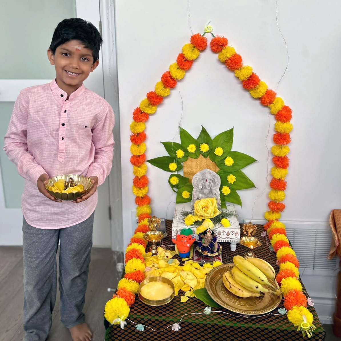 Smiling ABK student after completing Ganesha puja