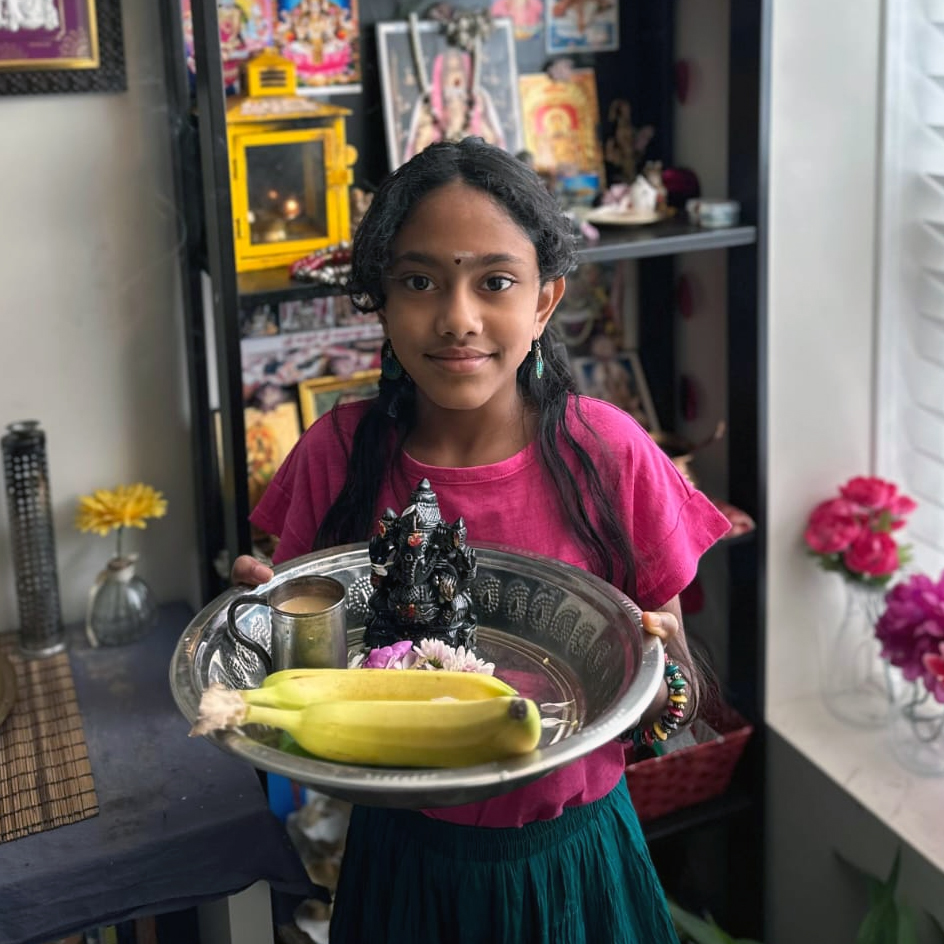 Smiling ABK student after completing Ganesha puja