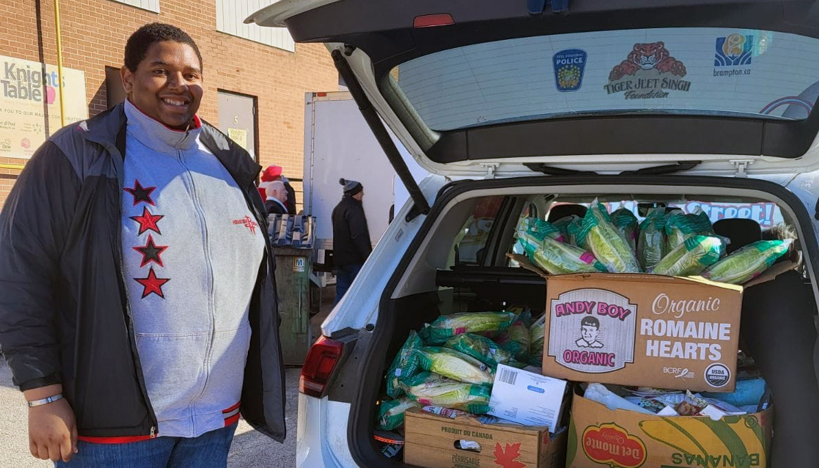 Volunteer at Brampton's Knight's Table collecting food donations 'rescued' by Amma Canada