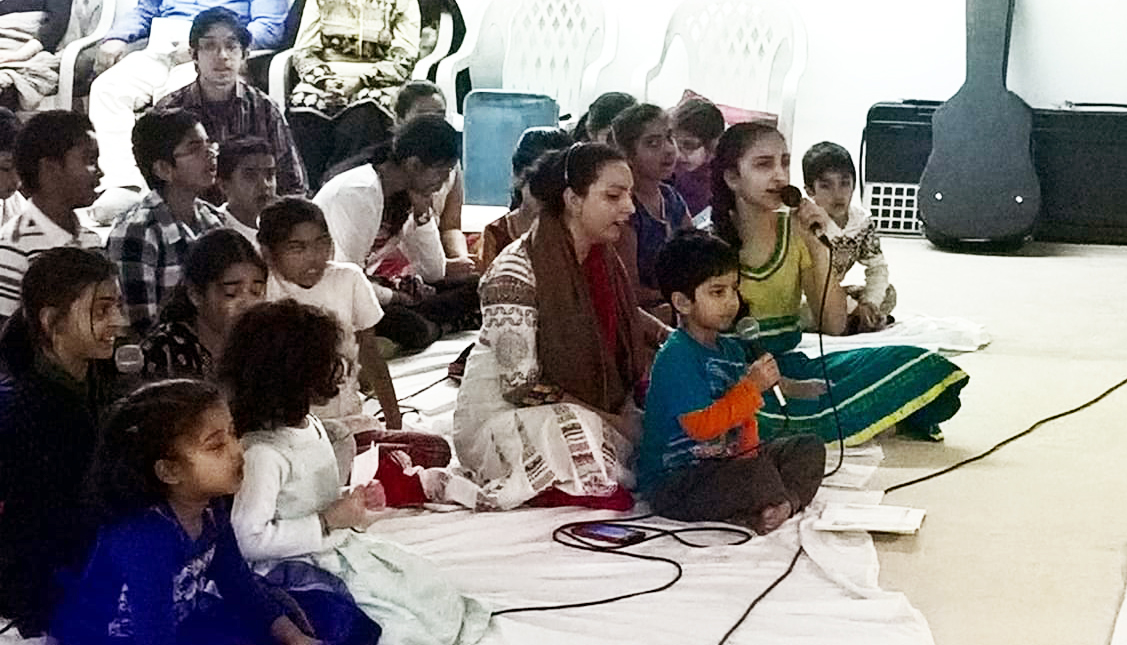 Bala Kendra children singing a bhajan together