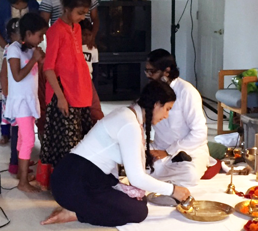 Devotees doing Guru Pada Puja
