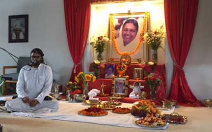 Br Ramanand beside altar