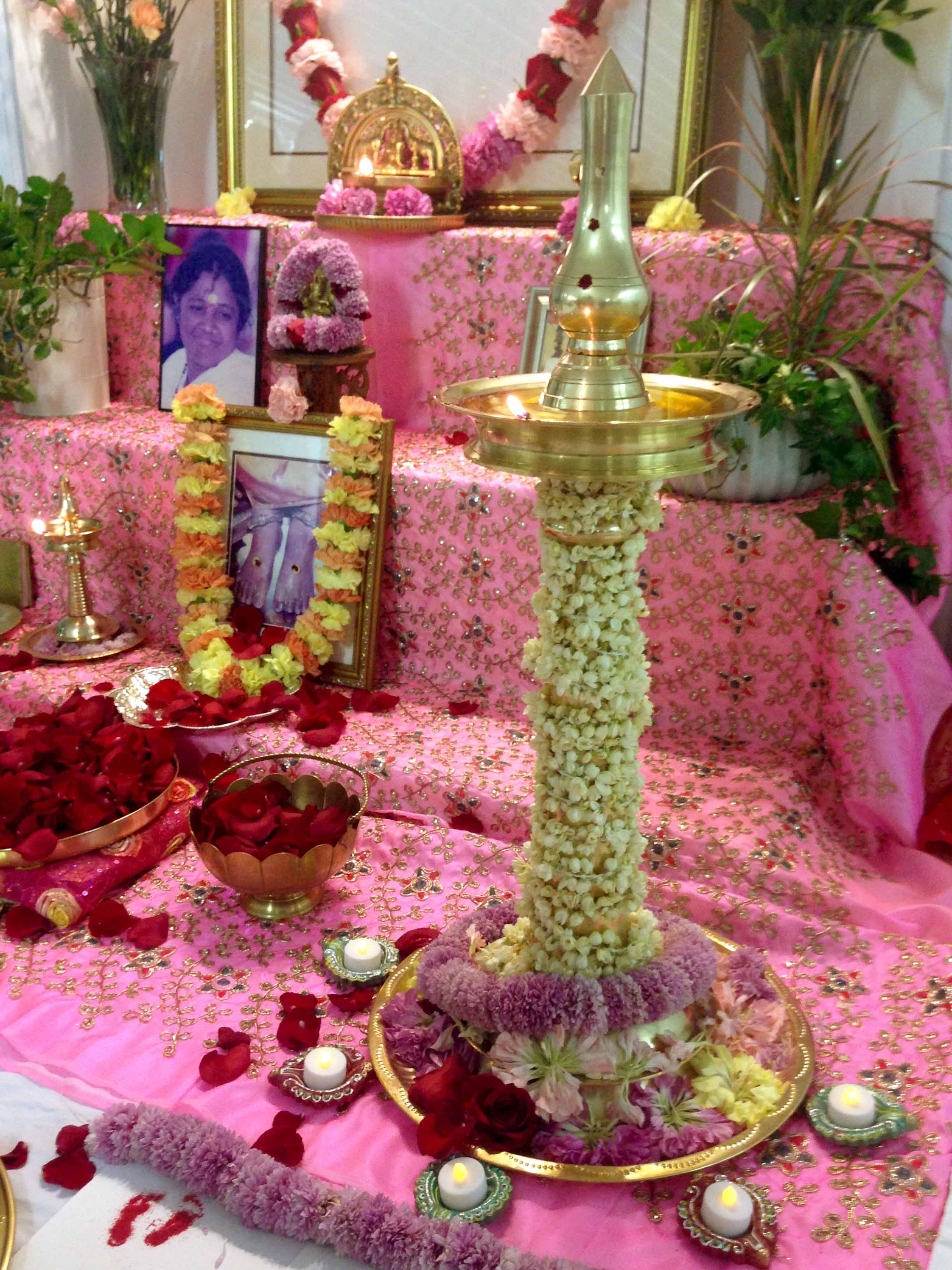 Brass lamp decorated with jasmine garland