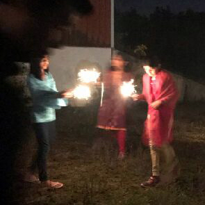 Kids playing with sparklers in the dark