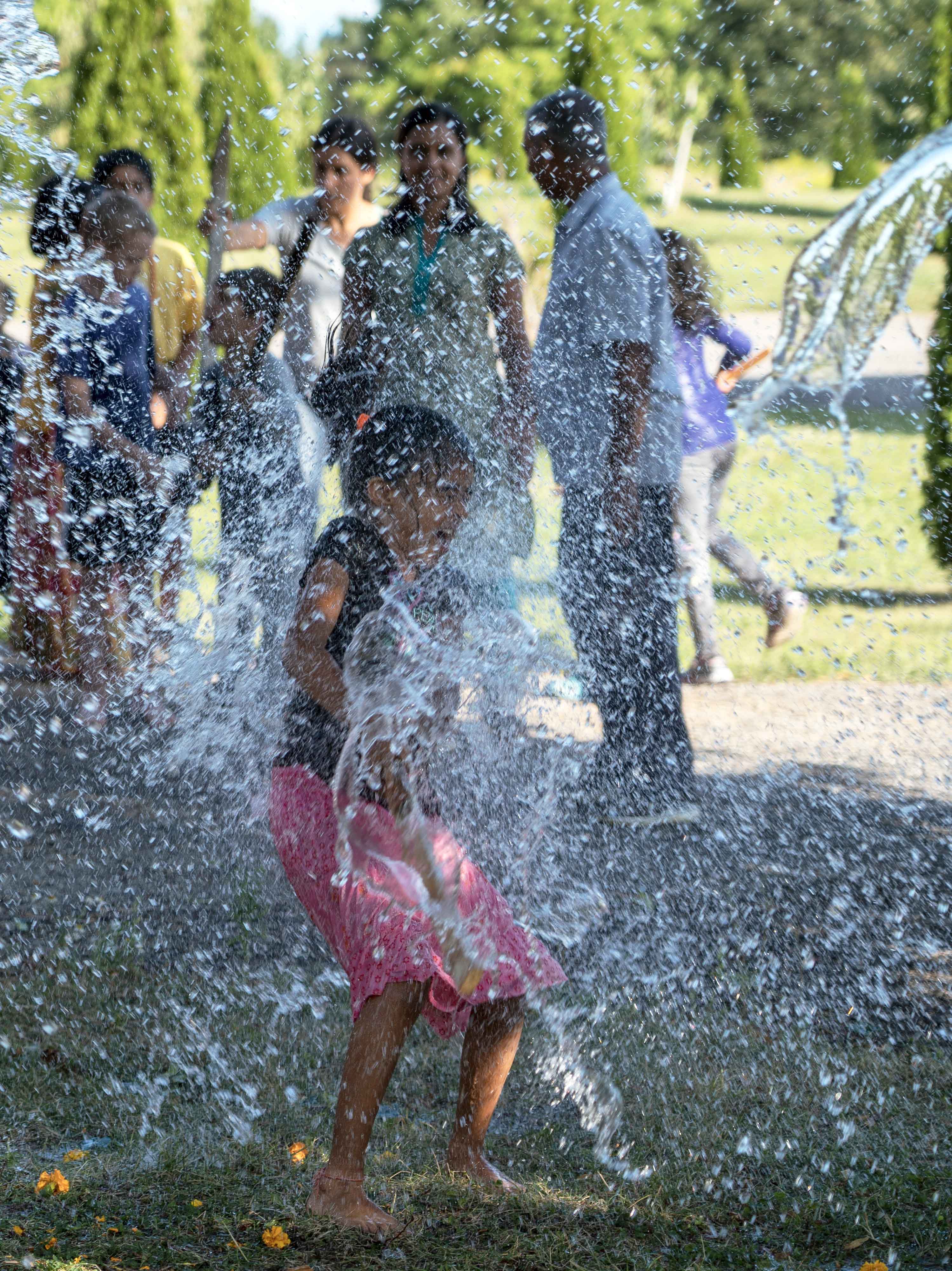 Girl getting splashed with water