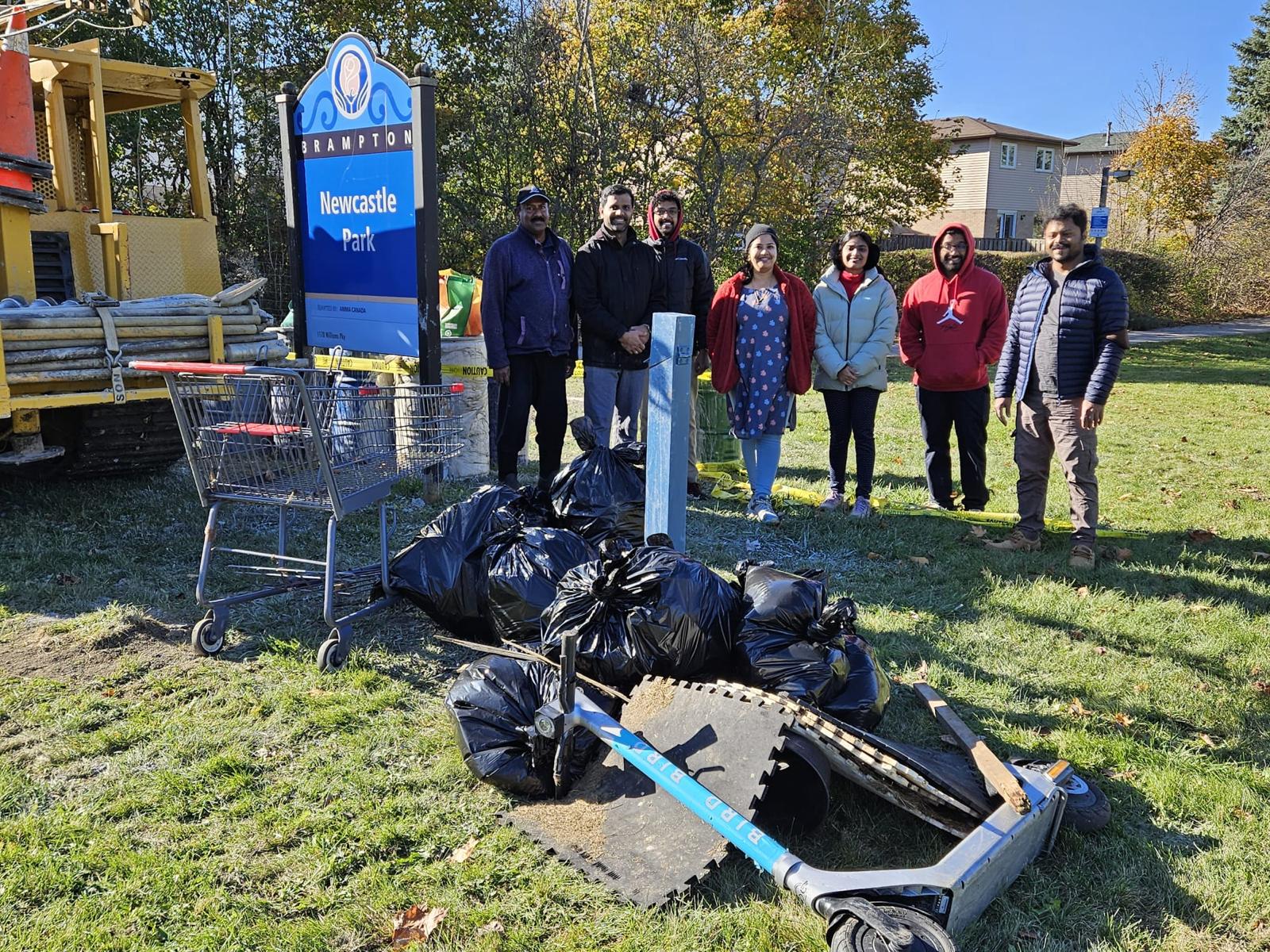 Amma Canada volunteers with trash they collected in Newcastle Park