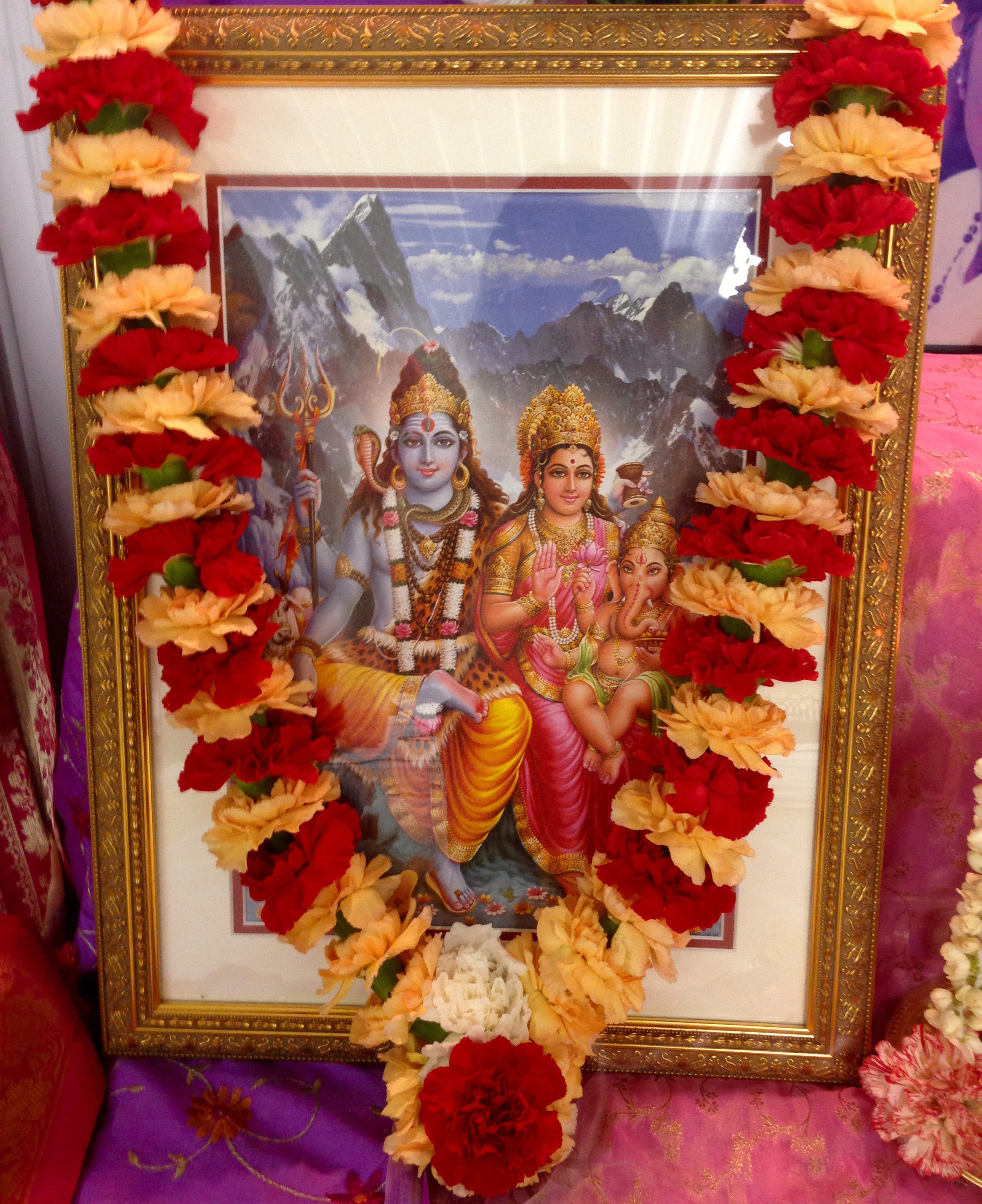 Picture of Shiva, Parvati and Ganesha with garland