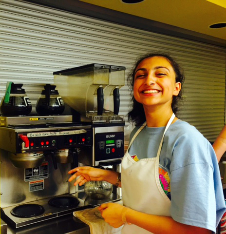 AYUDH volunteer serving coffee at St Felix Centre